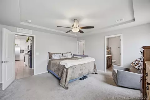 Bedroom - 7403 E 87th St N, Owasso, OK 74055 photo 2 of 5
