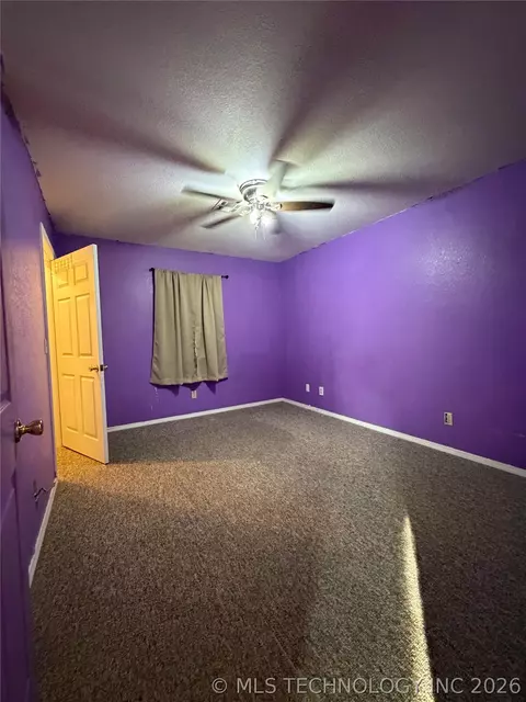 Bedroom - 215 NE 7th St, Checotah, OK 74426 photo 2 of 3
