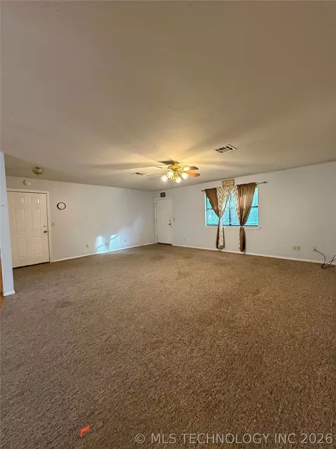 Living - 215 NE 7th St, Checotah, OK 74426 photo 2 of 2