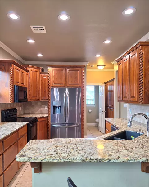 Kitchen - 823 Cypress Dr, Ada, OK 74820 photo 2 of 3
