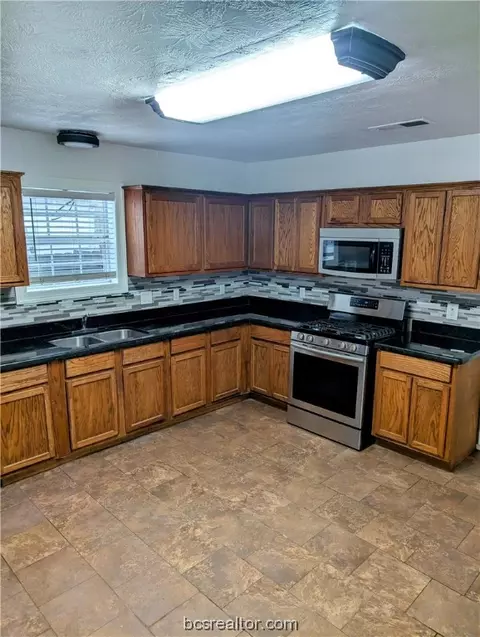 Kitchen - 1100 E 28th St, Bryan, TX 77803 photo 1 of 2