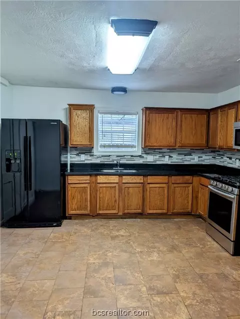 Kitchen - 1100 E 28th St, Bryan, TX 77803 photo 2 of 2