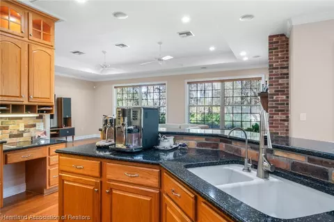 Kitchen - 3875 Enchanted Oaks Ln, Sebring, FL 33875 photo 4 of 6