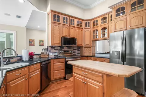Kitchen - 3875 Enchanted Oaks Ln, Sebring, FL 33875 photo 2 of 6