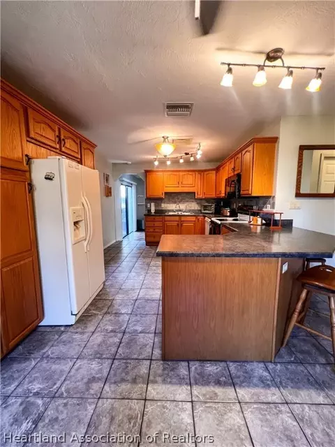 Kitchen - 4924 Cricket Dr, Sebring, FL 33876 photo 3 of 7
