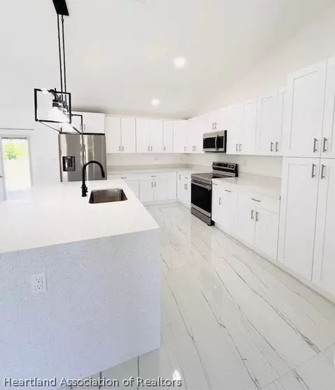 Kitchen - 459 Thiseldo Ln, Sebring, FL 33875 photo 2 of 6