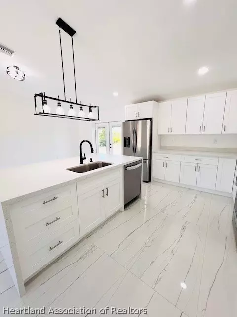 Kitchen - 459 Thiseldo Ln, Sebring, FL 33875 photo 3 of 6