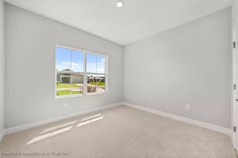 Bedroom - 5289 Pebble Beach Dr, Sebring, FL 33872 photo 6 of 13