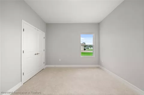 Bedroom - 5289 Pebble Beach Dr, Sebring, FL 33872 photo 9 of 13