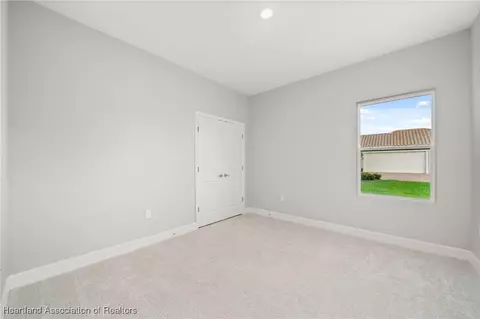 Bedroom - 5289 Pebble Beach Dr, Sebring, FL 33872 photo 10 of 13