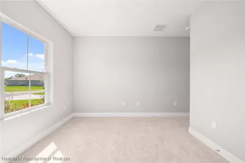 Bedroom - 5289 Pebble Beach Dr, Sebring, FL 33872 photo 11 of 13