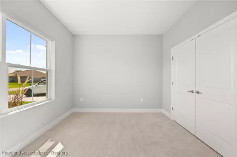 Bedroom - 5289 Pebble Beach Dr, Sebring, FL 33872 photo 5 of 13