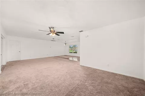 Living - 1708 Elf Dr, Sebring, FL 33875 photo 4 of 9