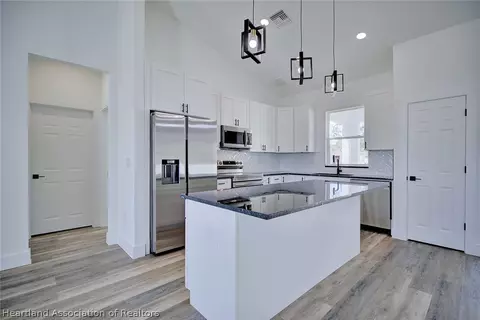 Kitchen - 627 Lemans Dr, Sebring, FL 33872 photo 3 of 7