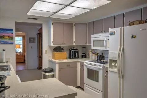 Kitchen - 7316 Lime Tree Ct, Sebring, FL 33876 photo 2 of 3