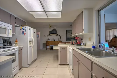 Kitchen - 7316 Lime Tree Ct, Sebring, FL 33876 photo 3 of 3