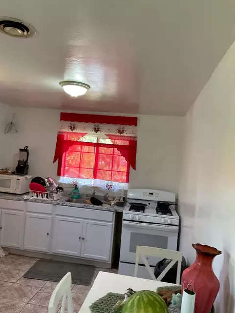 Kitchen - 303 Plainsburg Rd, Planada, CA 95365 photo 3 of 7