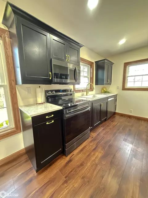 Kitchen - 716 1st Ave NE, Hampton, IA 50441 photo 2 of 3
