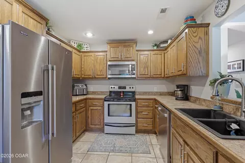 Kitchen - 203 E 5th Street Purcell Mo 64857 St, Purcell, MO 64857 photo 2 of 2