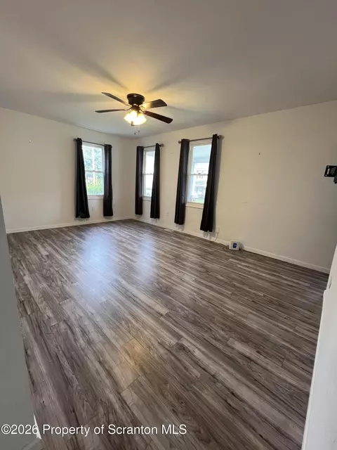 Living - 412 Delaware Ave, Olyphant, PA 18447 photo 2 of 3