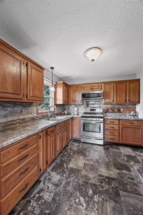 Kitchen - 307 Cottage St NW, Shellsburg, IA 52332 photo 3 of 5