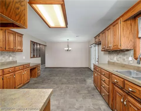 Kitchen - 706 Delaware St, Sallisaw, OK 74955 photo 2 of 3
