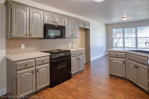 Kitchen - 400 Village Dr, Lavaca, AR 72941 photo 3 of 4