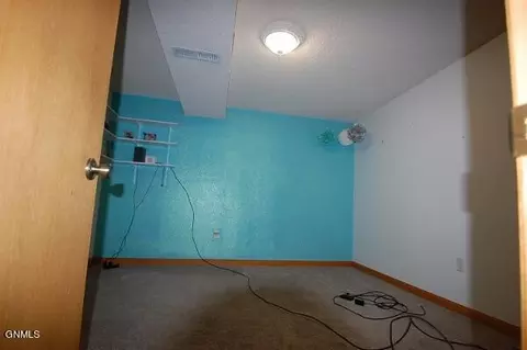 Bedroom - 702 6th St SE, Sidney, MT 59270 photo 4 of 4
