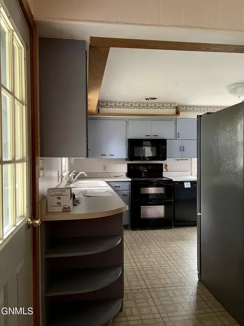 Kitchen - 820 8th Ave SE, Sidney, MT 59270 photo 3 of 3