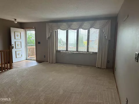 Living - 719 8th St E, Williston, ND 58801 photo 1 of 2