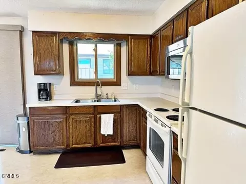 Kitchen - 1207 E Ridge Ct, Williston, ND 58801 photo 3 of 3