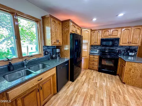Kitchen - 5150 57th St SE, Bismarck, ND 58504 photo 2 of 4