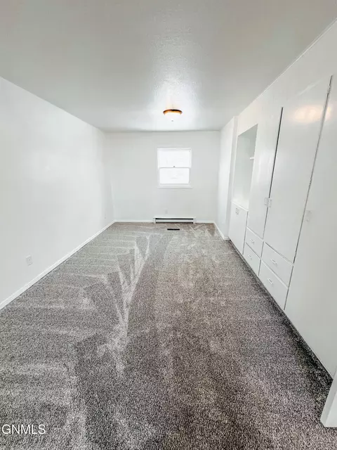 Bedroom - 614 3rd Ave W, Williston, ND 58801 photo 2 of 12