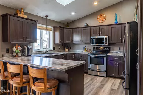 Kitchen - 302 Stuttgart Dr, Bismarck, ND 58504 photo 2 of 8