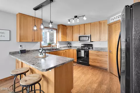Kitchen - 7606 Moonlite Rd, Bismarck, ND 58503 photo 2 of 7