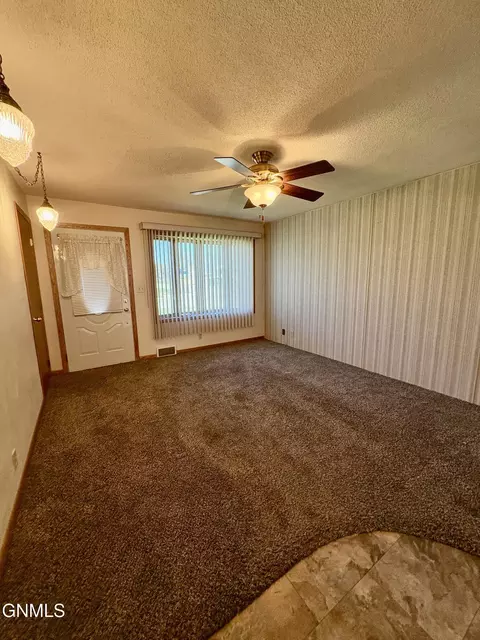 Living - 824 4th Ave W, Williston, ND 58801 photo 2 of 3