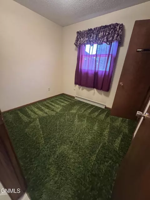 Bedroom - 464 9th St E, Dickinson, ND 58601 photo 2 of 8