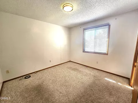 Bedroom - 67 17 St E, Dickinson, ND 58601 photo 3 of 4
