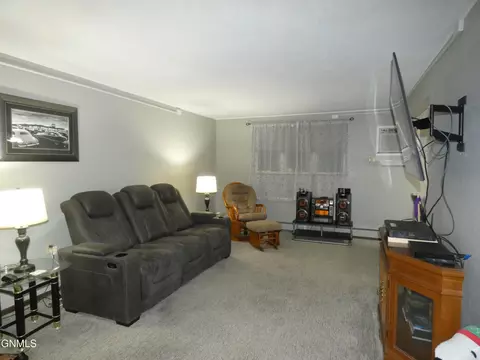 Living - 607 Interstate Ave E, Bismarck, ND 58503 photo 3 of 4