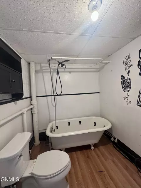 Bath - 134 E Broadway St, Dickinson, ND 58601 photo 1 of 5