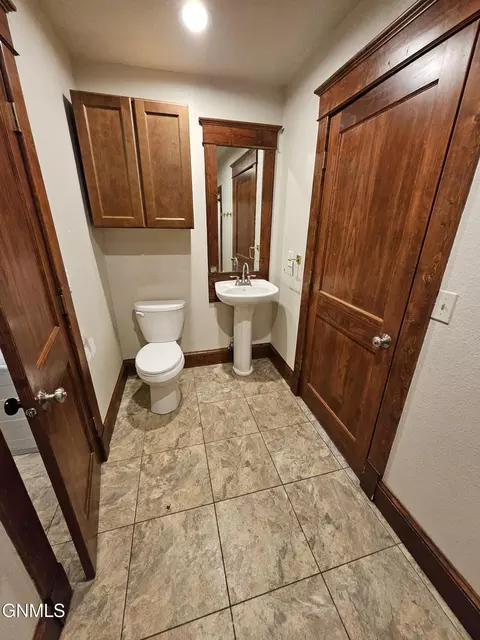 Bath - 230 4th Ave W, Dickinson, ND 58601 photo 2 of 5