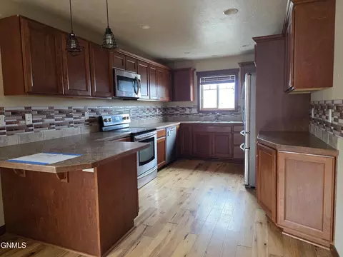 Kitchen - 1228 23rd St W, Dickinson, ND 58601 photo 1 of 2