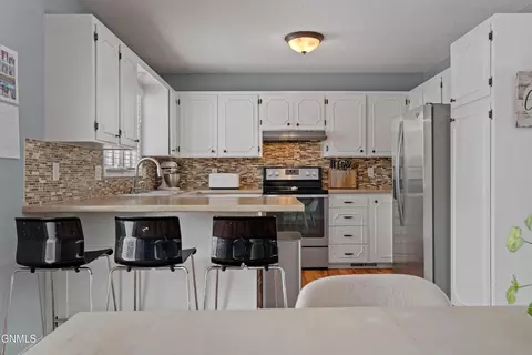 Kitchen - 300 Telstar Dr, Bismarck, ND 58503 photo 2 of 2