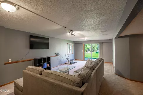 Living - 414 E Brandon Dr, Bismarck, ND 58503 photo 3 of 5
