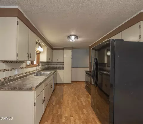 Kitchen - 807 20th St E, Williston, ND 58801 photo 3 of 3