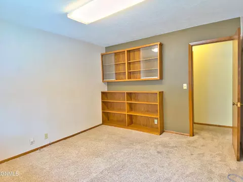 Bedroom - 911 3rd Ave E, Williston, ND 58801 photo 2 of 11