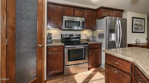 Kitchen - 306 Brandenburg Loop, Bismarck, ND 58504 photo 2 of 3