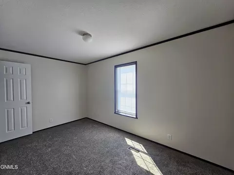 Bedroom - 714 27th St W, Williston, ND 58801 photo 2 of 3