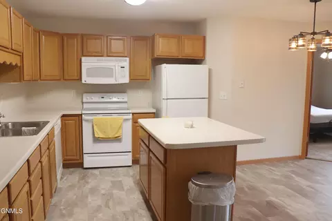 Kitchen - 131 3rd Ave SE, Mandan, ND 58554 photo 7 of 8