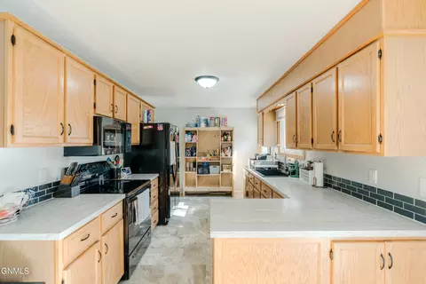 Kitchen - 810 3rd Ave NE, Mandan, ND 58554 photo 5 of 8
